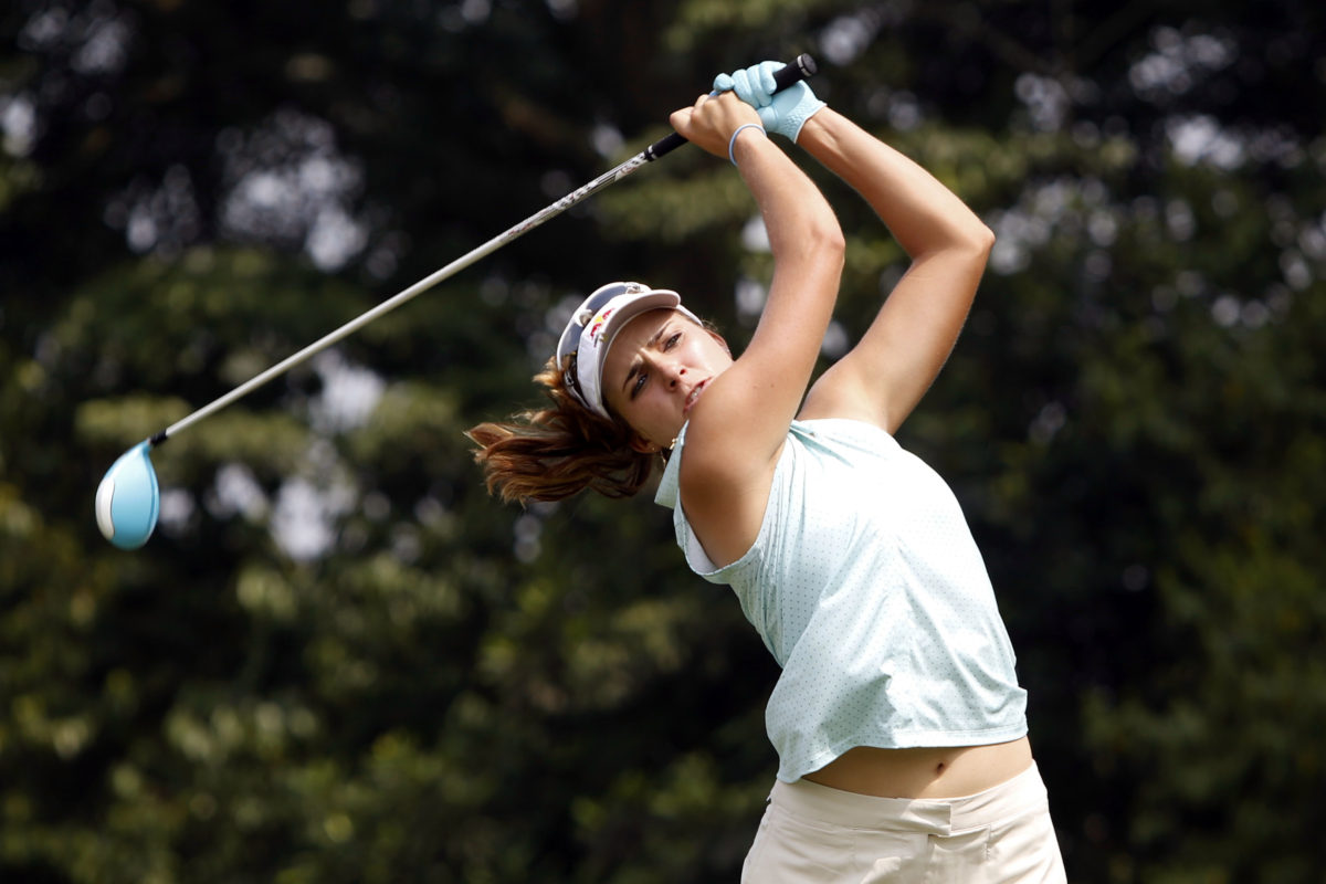 Lexi Thompson of the United States tees off from the sixth hole during the first round of the LPGA Malaysia golf tournament at Kuala Lumpur Golf and Country Club in Kuala Lumpur, Malaysia on Thursday, Oct. 8, 2015. (AP Photo/Joshua Paul)